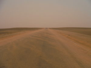 The sand of Sahara blows on the road, Dar Kaoua